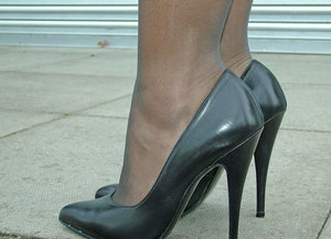 18 year old girl Megan Rain removes her sandals and then clothes to pose naked